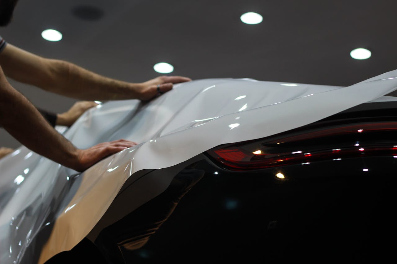 embark Professional car wrapping in progress, showcasing sleek modern vehicle enhancement.
